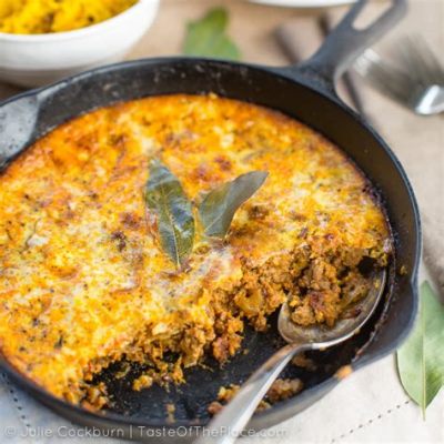  Bobotie! Een Pittige Zuid-Afrikaanse Ovenschotel Met Orientse Kruiden En Een Romige Eiensaus.