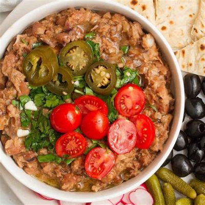  Ful Medames: Een Romige Bonenschotel Gecombineerd met De Hemelse Smaak van Knoflook en Citroensap!